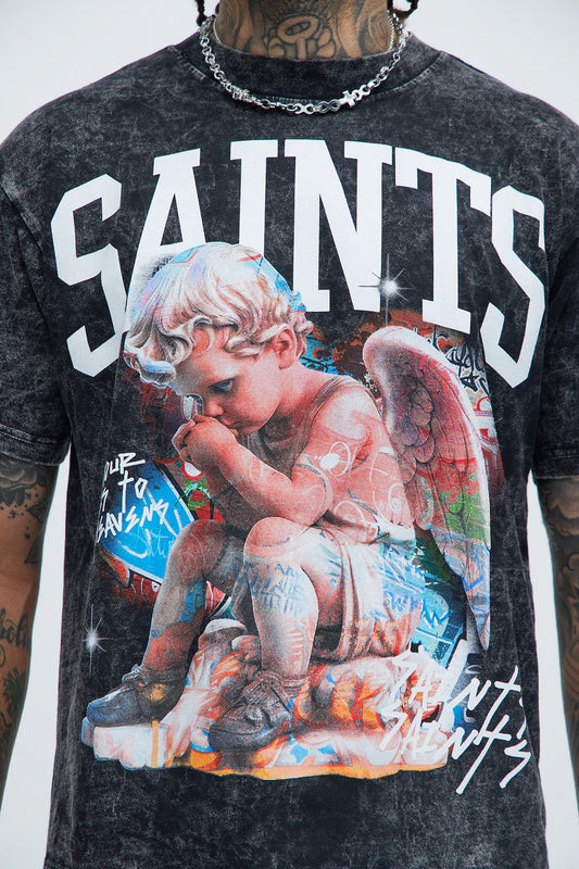 Black t-shirt with an angel graphic and 'SAINTS' text on a plain background